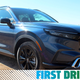 A photo of the front quarter on the CR-V Hybrid SUV with the First Drive banner.